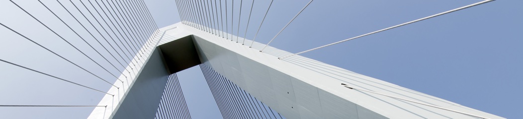 Top of white bridge with blue sky